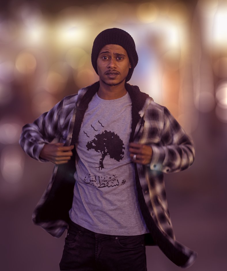 sudanese young man wearing tasgot bas gray t-shirt