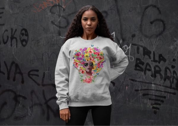 afro-roses-sweatshirt-crewneck-sweatshirt-mockup-of-a-woman-posing-against-a-graffiti-wall