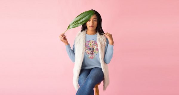 afro-roses-sweatshirt-mockup-of-a-girl-wearing-a-crewneck-sweatshirt-and-a-faux-fur-vest